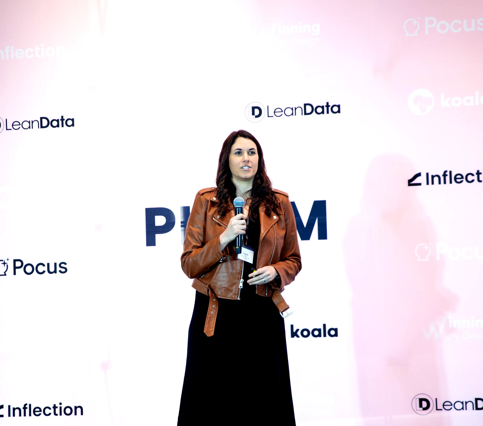 Angela Winegar speaking at PLGTM Expo